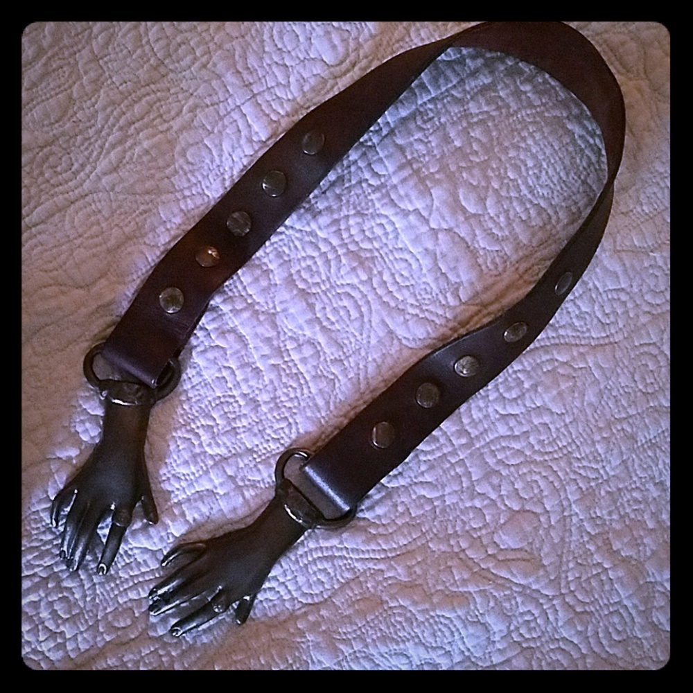 Vintage hand holding belt